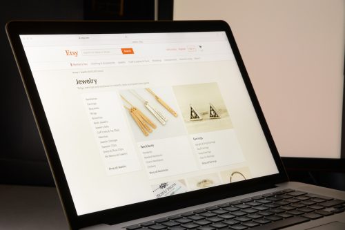 Laptop screen showing an Etsy jewelry page