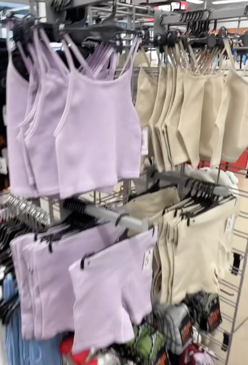 Purple and beige workout sets on the rack at Five Below