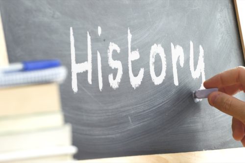 the word "history" written on a blackboard