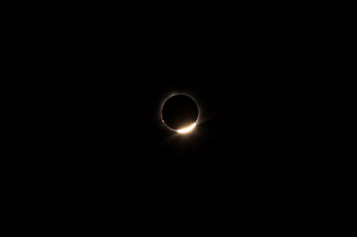 hybrid solar eclipse, Exmouth, Australia, 20.04.2023, diamond, the last ray of light before the moon is covering the sun completely, nightscape, night full of stars