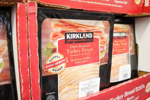 A view of several packages of Kirkland Signature oven roasted turkey breast, on display at a local Costco.