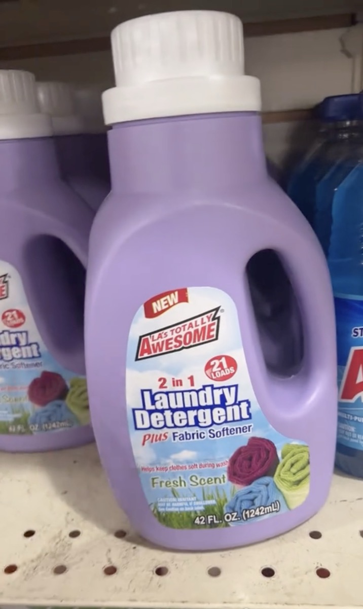 A bottle of L.A.'s Totally Awesome Laundry Detergent on the shelf at Dollar Tree