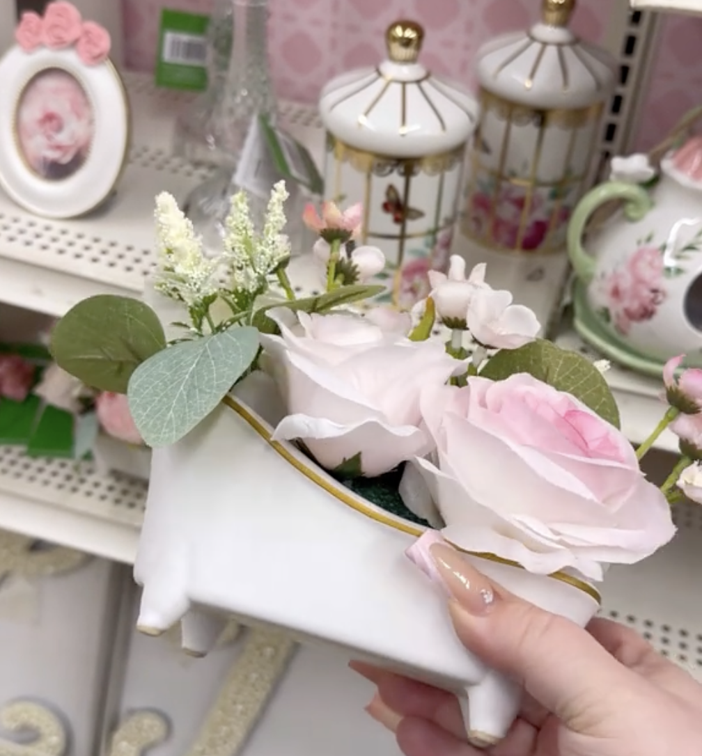 Display of pink and white home decor at Michaels