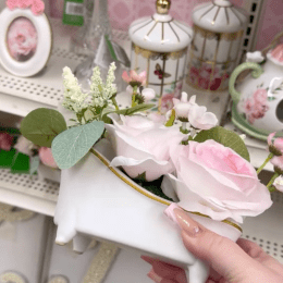 Display of pink and white home decor at Michaels
