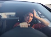 Depressed young woman driver sitting inside car, feeling doubtful confused about difficult decision suffering from personal psychological problem, burnout, quarrel break up with boyfriend, life crisis