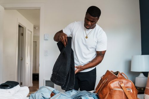 Man packing luggage for trip