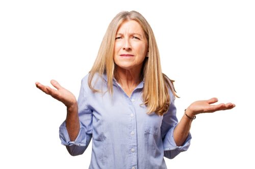 blonde woman shrugging her shoulders and looking confused