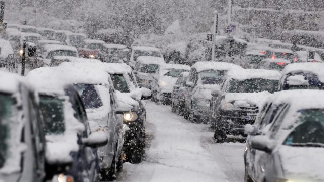 A traffic jam during a snowstorm or blizzard.