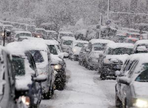 A traffic jam during a snowstorm or blizzard.