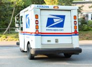 USPS mail truck turning on the street