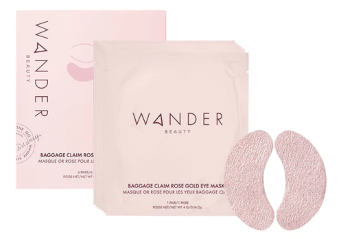 Wander Beauty rose gold Baggage Claim Eye Masks and pink packaging on white background