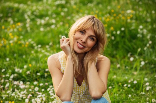 Smiling young woman enjoying summer