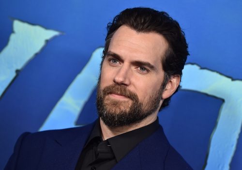 portrait of Henry Cavill against blue background