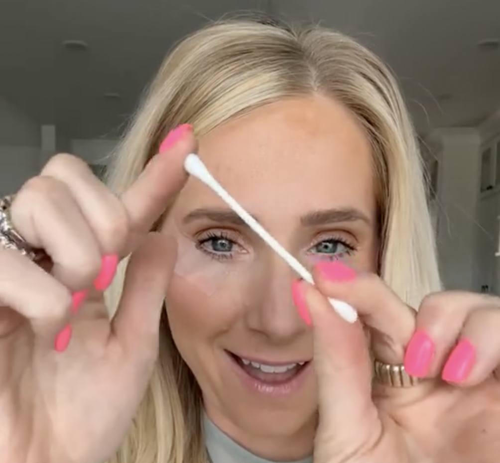 Makeup artist Lauren Hale posing with a Q-tip
