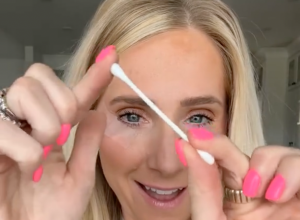Makeup artist Lauren Hale posing with a Q-tip