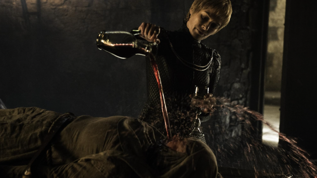 Lena Headey pouring liquid onto Hannah Waddingham in a Game of Thrones episode.