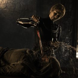 Lena Headey pouring liquid onto Hannah Waddingham in a Game of Thrones episode.