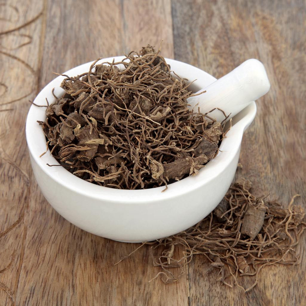 A bowl of black cohosh root supplement on a table