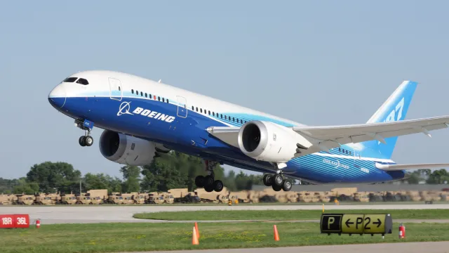 A Boeing 787 taking off from a runway