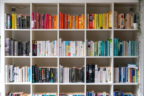 bookshelves arranged by color