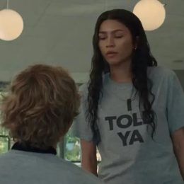 Zendaya wearing the "I TOLD YA" shirt in Challengers