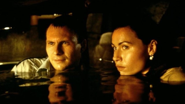 Still from the movie "Hard Rain" showing Christian Slater and Minnie Driver in water