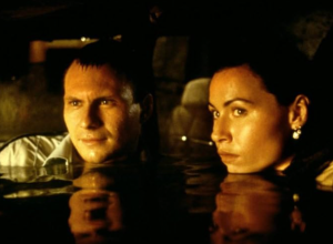 Still from the movie "Hard Rain" showing Christian Slater and Minnie Driver in water