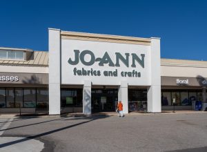 Sarasota, Florida, USA - January 11, 2022: A Woman walking into the JOANN Fabrics and Crafts store in Sarasota, Florida, USA. Jo-Ann is an American specialty retailer of crafts and fabrics.
