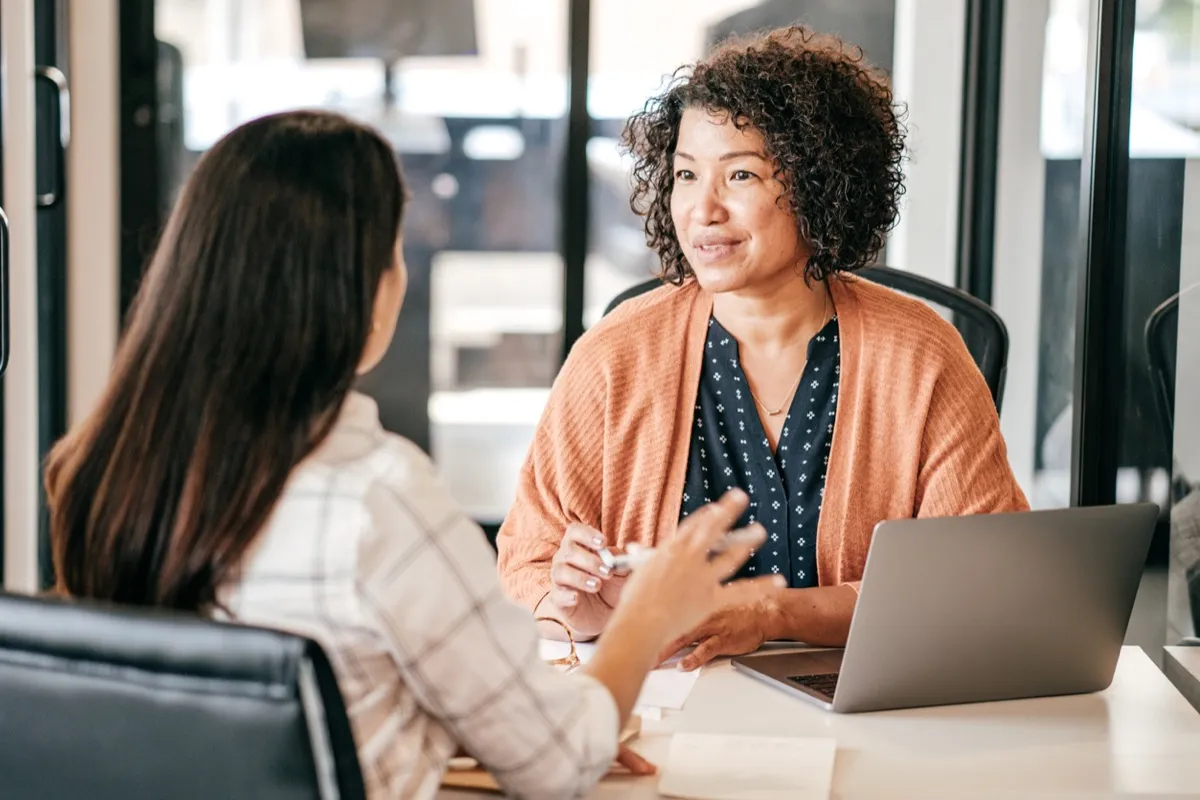 woman talking during job interview with another woman