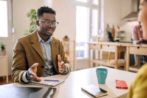 Man on a job interview in small home office