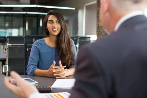 young interviewee talking about her strengths during interview