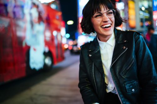 woman smiling in a leather jacket