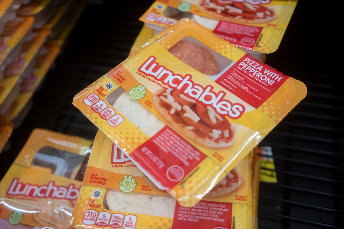 Lunchables Pizza with Pepperoni is seen in the cooler at a Walmart neighborhood market. Lunchables is a brand of food and snacks manufactured by Kraft Heinz.