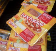 Lunchables Pizza with Pepperoni is seen in the cooler at a Walmart neighborhood market. Lunchables is a brand of food and snacks manufactured by Kraft Heinz.