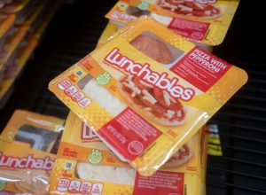 Lunchables Pizza with Pepperoni is seen in the cooler at a Walmart neighborhood market. Lunchables is a brand of food and snacks manufactured by Kraft Heinz.