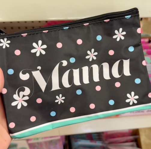 A shopper holds a cosmetic bag that says "mama" while shopping for the best Mother's Day gifts at Dollar Tree.
