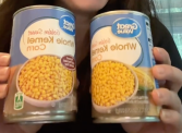 two cans of Walmart Great Value corn