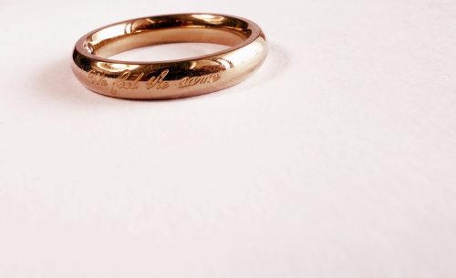 Rose gold ring engraved with the saying "we feel the same."