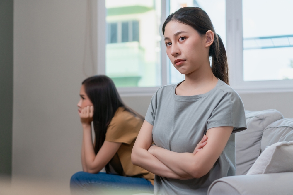 Young women sisters in argument or fight
