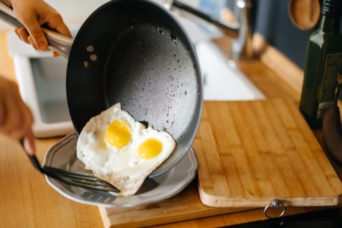 cooking eggs in a frying pan