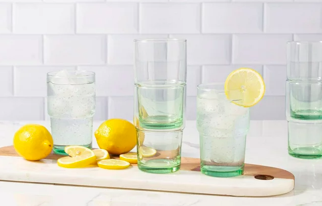 Green glassware sits on a counter as one of the Pottery Barn dupes at Walmart