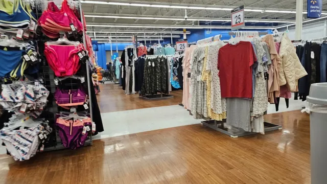 Racks of clothes on display for sale at Walmart store
