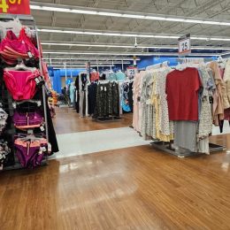 Racks of clothes on display for sale at Walmart store