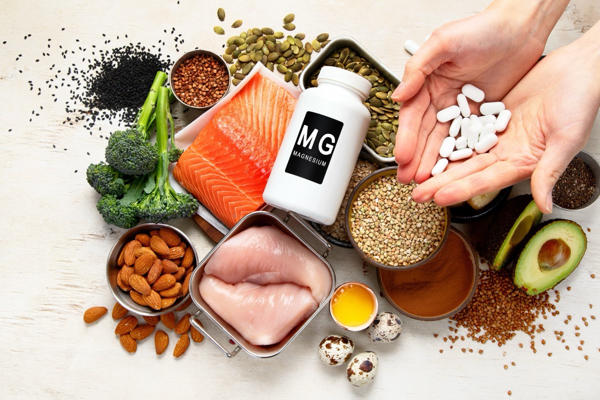Foods containing natural magnesium alongside hands holding magnesium supplements