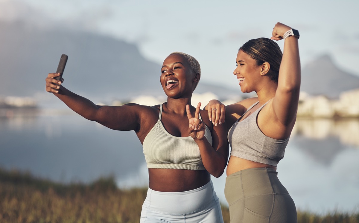 Shot of two women taking a selfie while out for a runt together