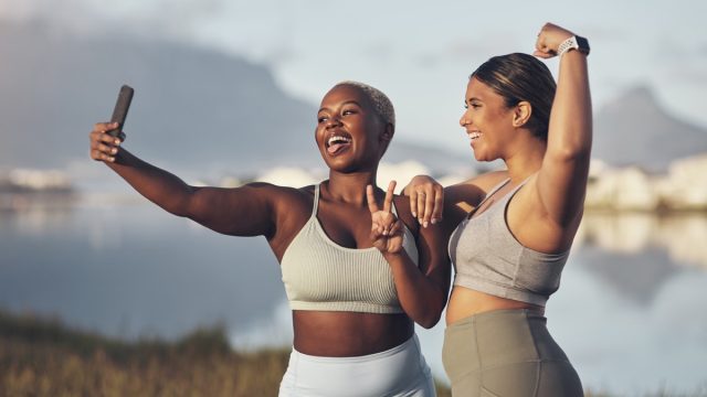 Shot of two women taking a selfie while out for a runt together