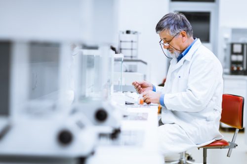 man working as a medical technician in a lab