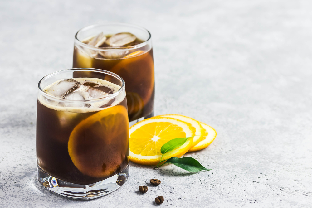 A citrus cold brew coffee with lemon slices