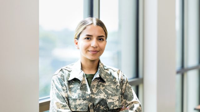 A female soldier standing in her uniform