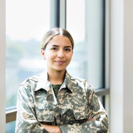 A female soldier standing in her uniform